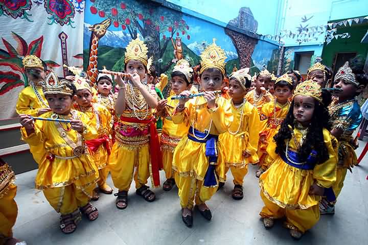 Kids Wearing Lord Krishna Costumes During Krishna Janamashtmi Festival