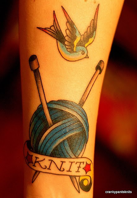 Knit Yarn Ball With Bird Tattoo On Forearm
