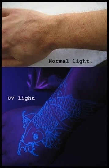 Koi Fish UV Tattoo In Daylight And Blacklight On Hand