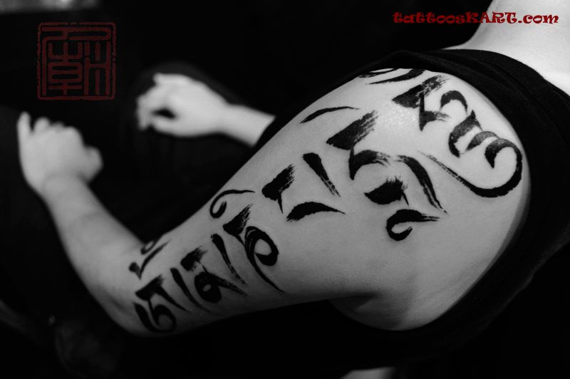 Latest Tibetan Script Tattoo On Left Half Sleeve