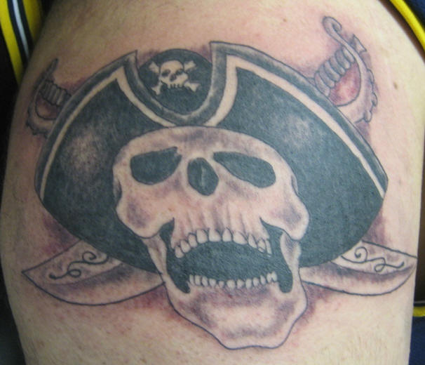 Laughing Pirate Skull And Swords Tattoo