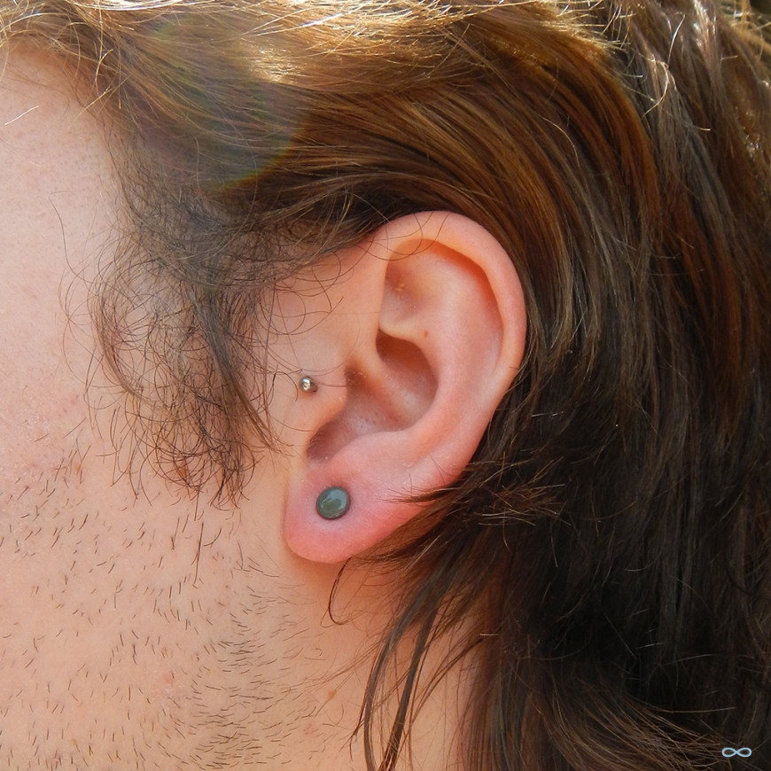 Left Ear Tragus And Earlobe Piercing