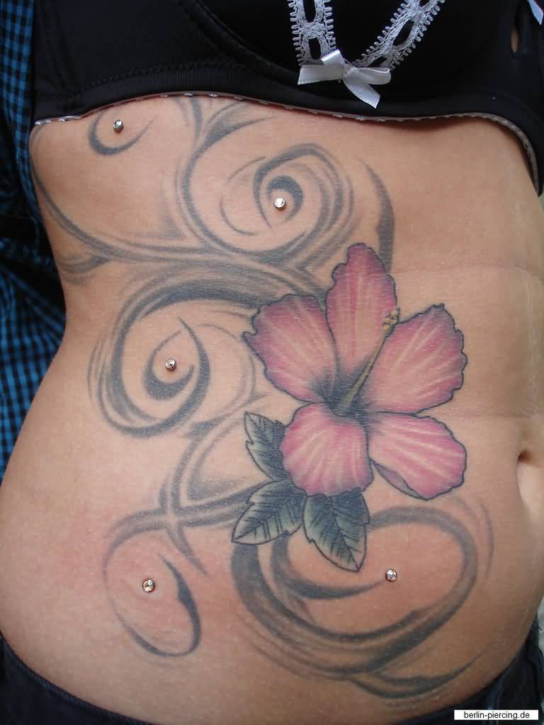Lily Flower And Dermal Anchor Piercings On Side Rib