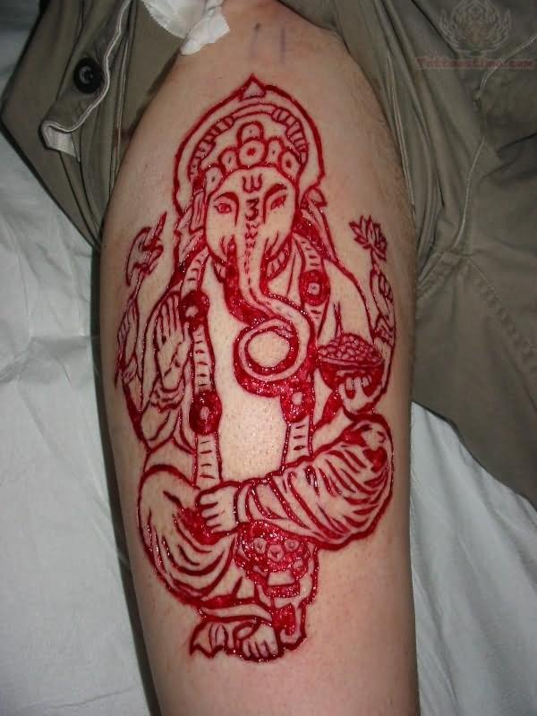 Lord Ganesha Scarification Tattoo On Thigh