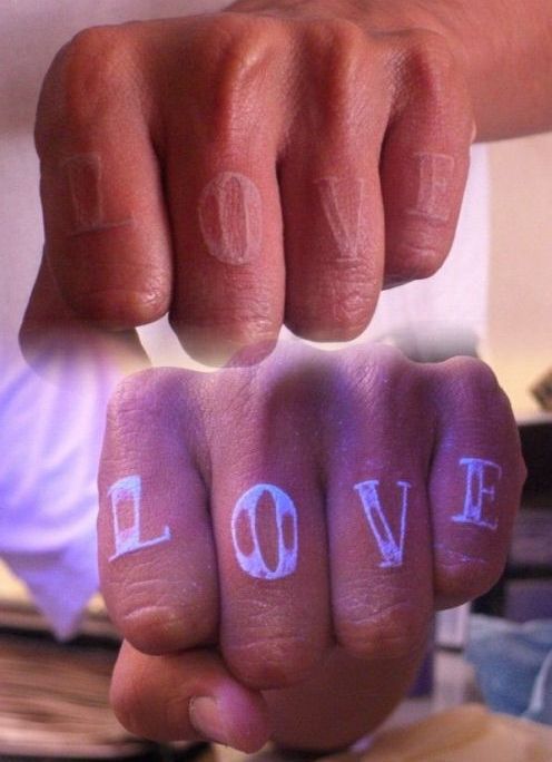 Love In Daylight And UV Light Tattoo On Fingers