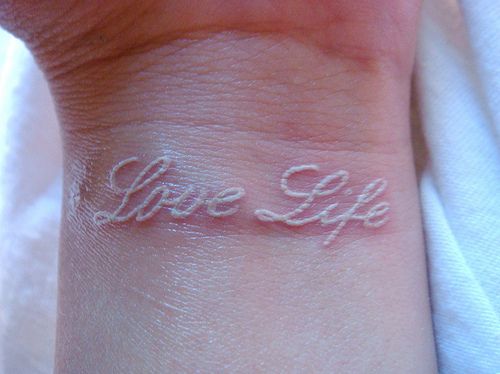 Love Life Scarification Tattoo On Wrist