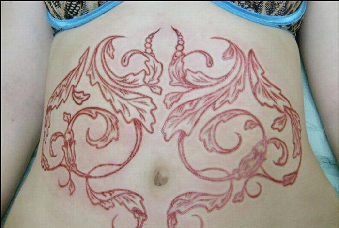 Lovely Scarification Tattoo Around Belly For Girls