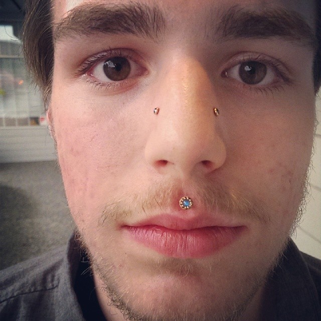 Man With Medusa And High Nostril Piercing. upper nostril piercing. 