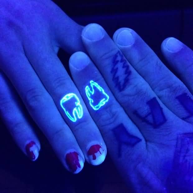 Matching Molar UV Ink Tattoos On Fingers