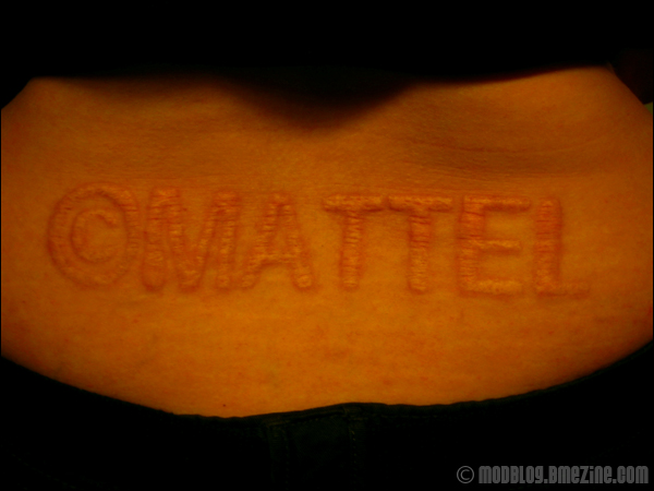 Mattel Scarification Tattoo On Lower Back