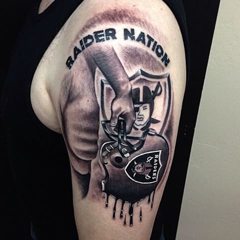Melting Oakland Raiders Helmet Left Half Sleeve Tattoo
