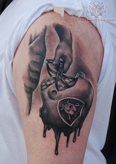Melting Oakland Raiders Helmet Tattoo On Left Shoulder