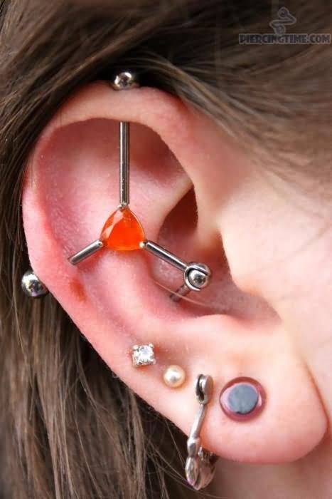 Multiple Ear Lobe And Ear Project Piercing On Girl Right Ear
