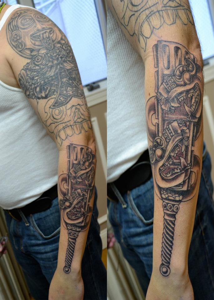 Nice Aztec Weapons Tattoo On Left Full Sleeve