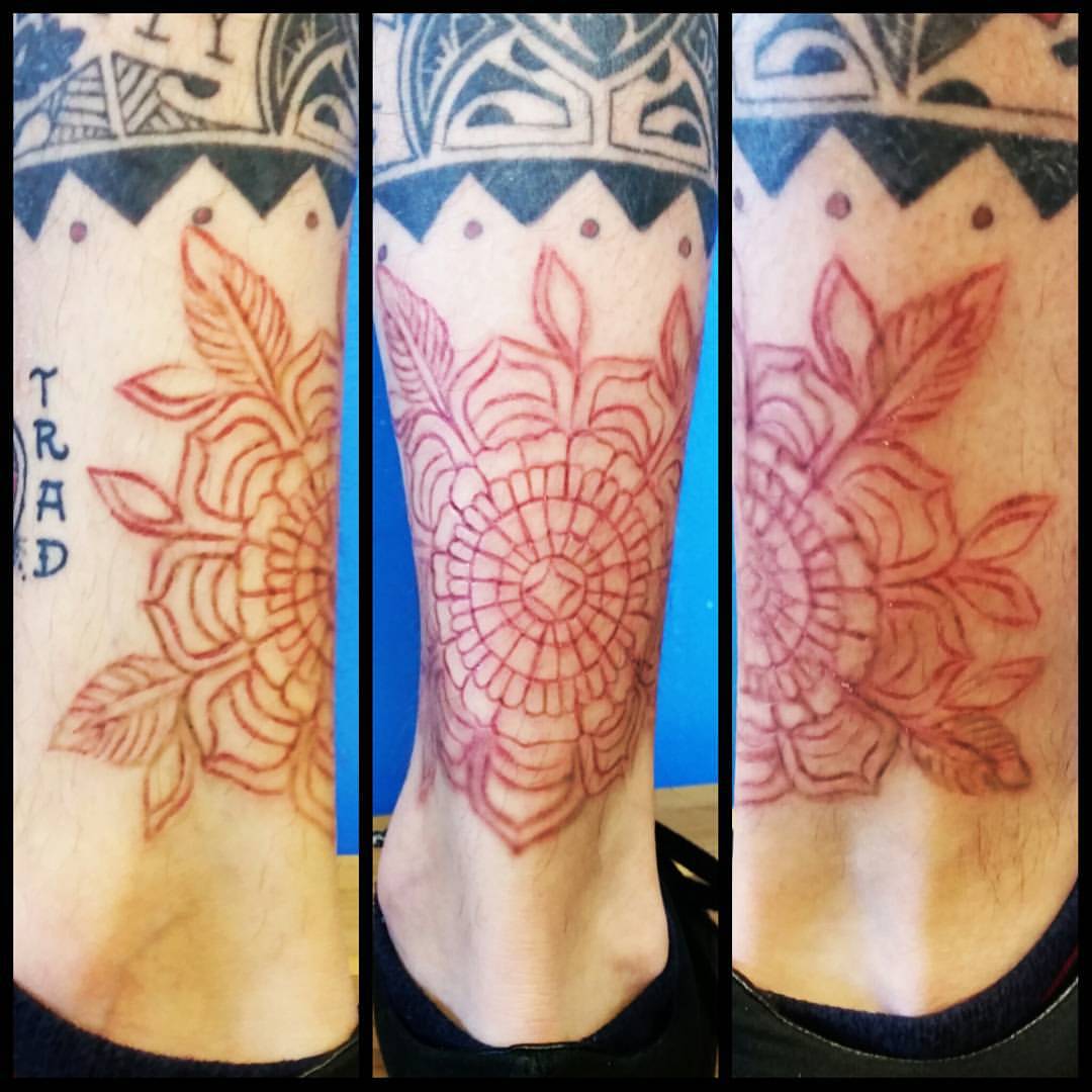 Nice Flower Scarification Tattoo On Ankle By Mr Diggler