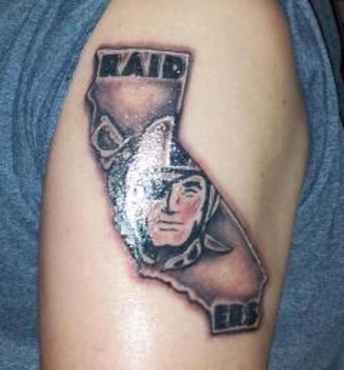 Nice Oakland Raiders Torn Logo Tattoo On Right Shoulder