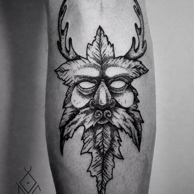 Nice Pagan God Face Tattoo On Forearm