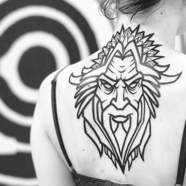 Nice Pagan God Tattoo On Upper Back For Girls