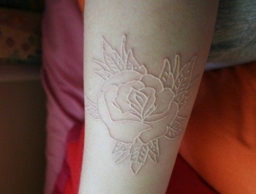 Nice Rose Scarification Tattoo On Arm