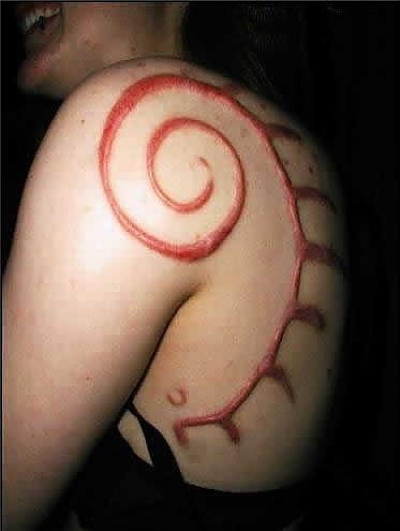 Nice Scarification Design Tattoo On Left Back Shoulder