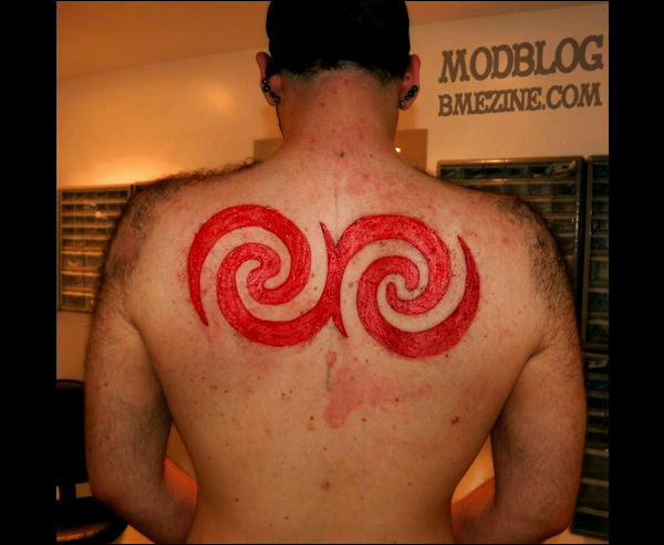 Nice Scarification Tattoo On Upper Back For Men