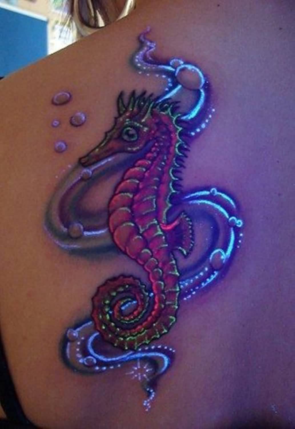 Nice Seahorse UV Tattoo On Left Back Shoulder