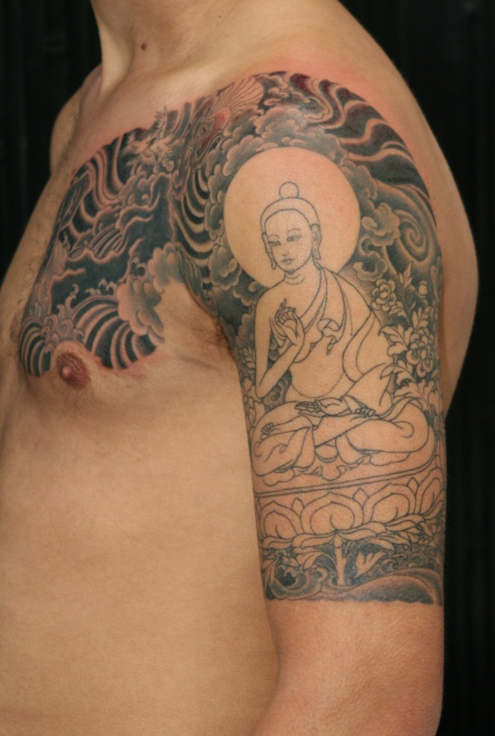 Nice Tibetan Buddhist Tattoo On Left Half Sleeve And Chest