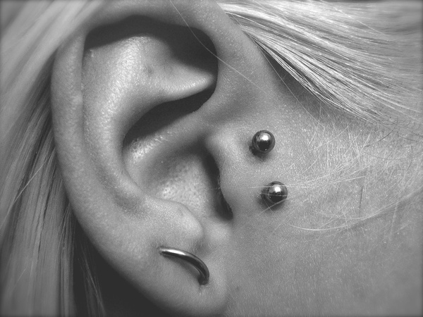 Orbital Lobe And Double Tragus Piercing With Silver Studs