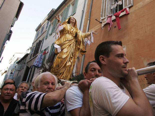 People Carrying The Statue Of Mother Mary During The Celebration Of  Assumption Of Mary