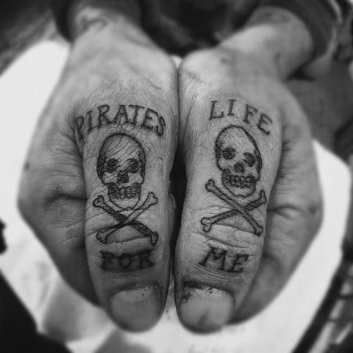 Pirate Life For Me Skulls Tattoos On Both Thumbs
