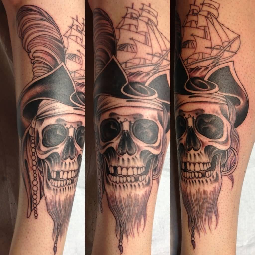 Pirate Skull Having Beard And Ship Tattoo On Arm