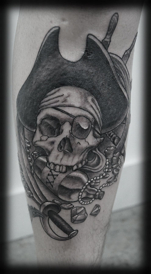 Pirate Skull With Bottle And Sword Arm Tattoo