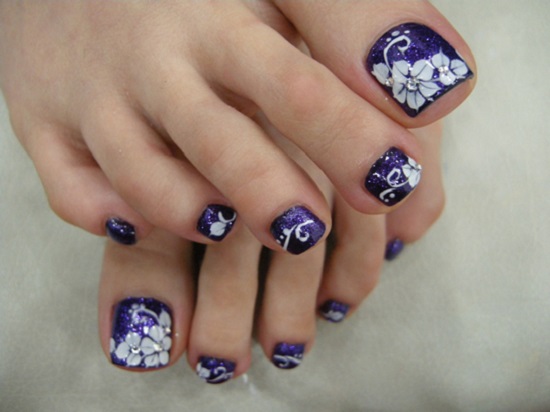 Purple Toe Nails With White Flowers And Rhinestones Design Idea