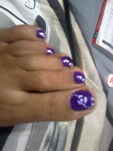 Purple Toe Nails With White Flowers Nail Art