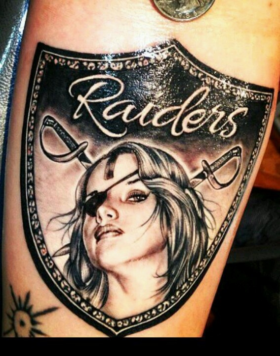 Realistic Female Oakland Raiders Shield Tattoo
