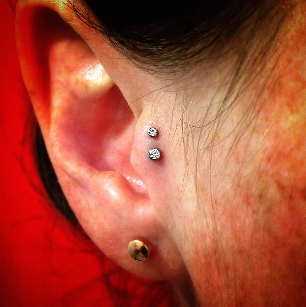 Right Ear Gold stud Lobe And Double Tragus Piercing