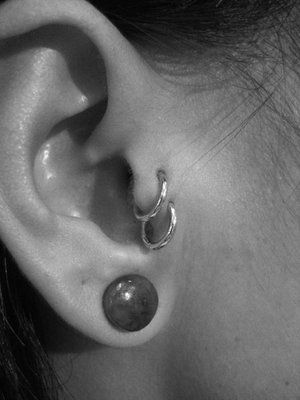 Right Ear Lobe And Double Tragus Piercing Picture