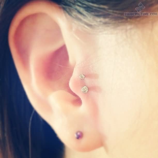 Right Ear Lobe And Double Tragus Piercing