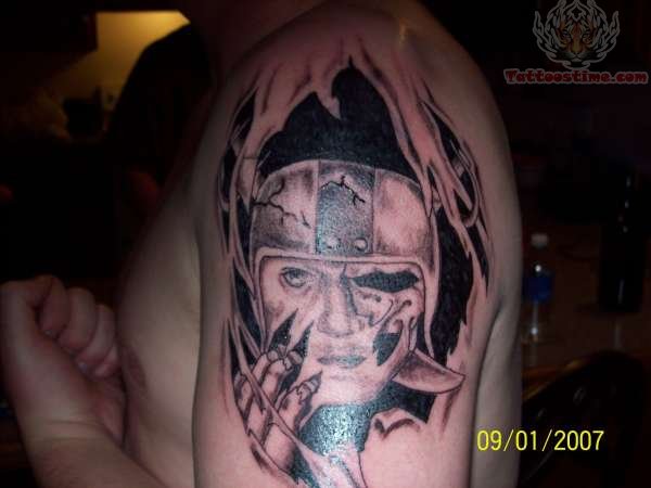 Ripped Skin Oakland Raiders Tattoo On Left Half Sleeve