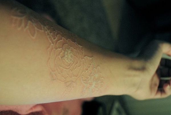 Rose Forearm Scarification Tattoo
