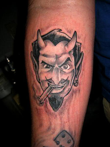 Satan With Cigar Tattoo On Forearm