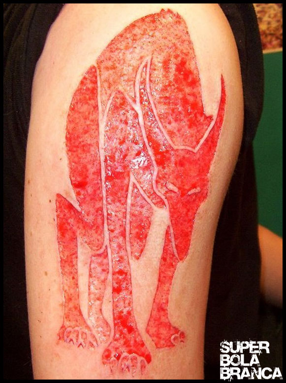 Scarification Devil Animal Tattoo On Half Sleeve