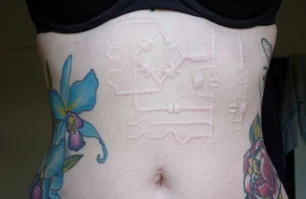 Scarification Tattoo Above Belly For Girls