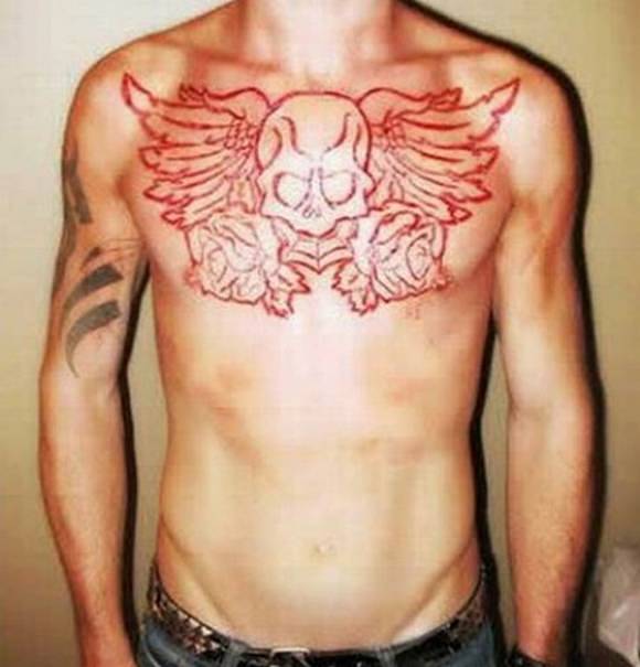 Scarification Winged Skull Tattoo On Chest For Men