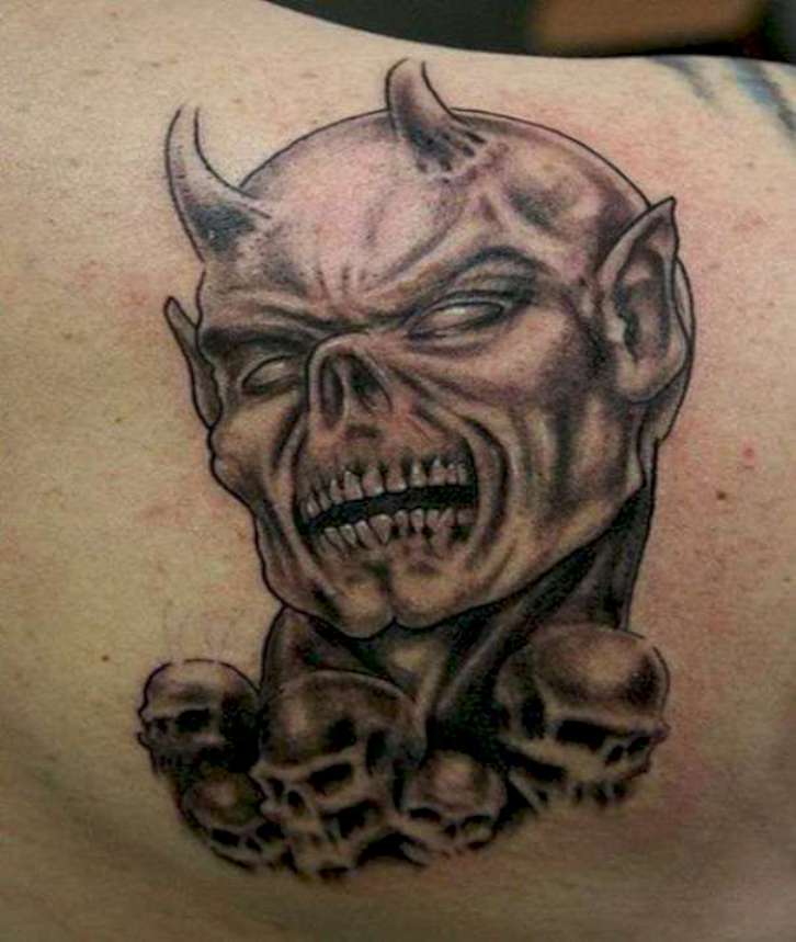 Scary Satan With Skulls Tattoo On Right Back Shoulder