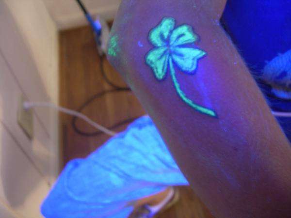 Simple Flower UV Tattoo On Half Sleeve