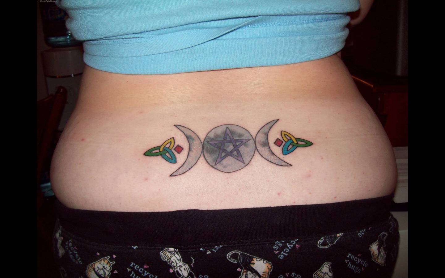 Simple Pagan Goddess Tattoo On Lower Back