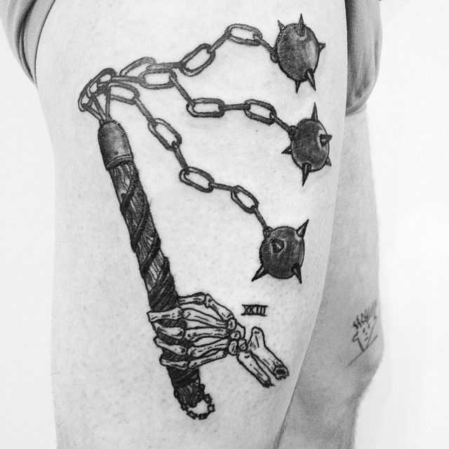 Skeleton Hand With Weapons Tattoo On Right Thigh