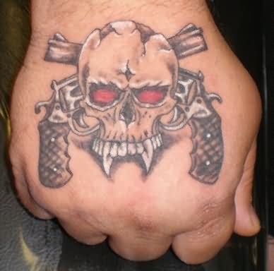 Skull And Guns Weapons Tattoo On Hand