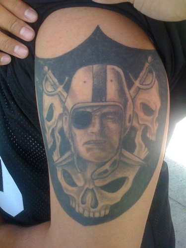Skulls And Oakland Raiders Logo Half Sleeve Tattoo